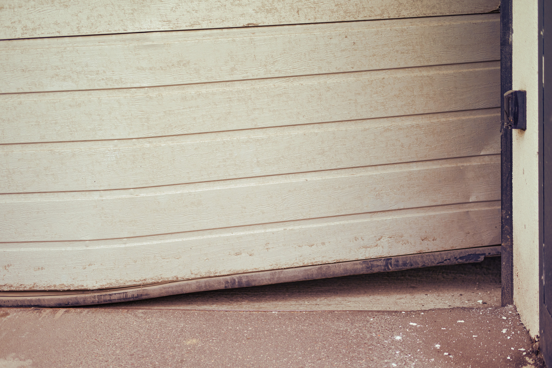 Why not to ignore small garage door damage image Why Ignoring Small Garage Door Problems Can Lead to Costly Repairs blog image