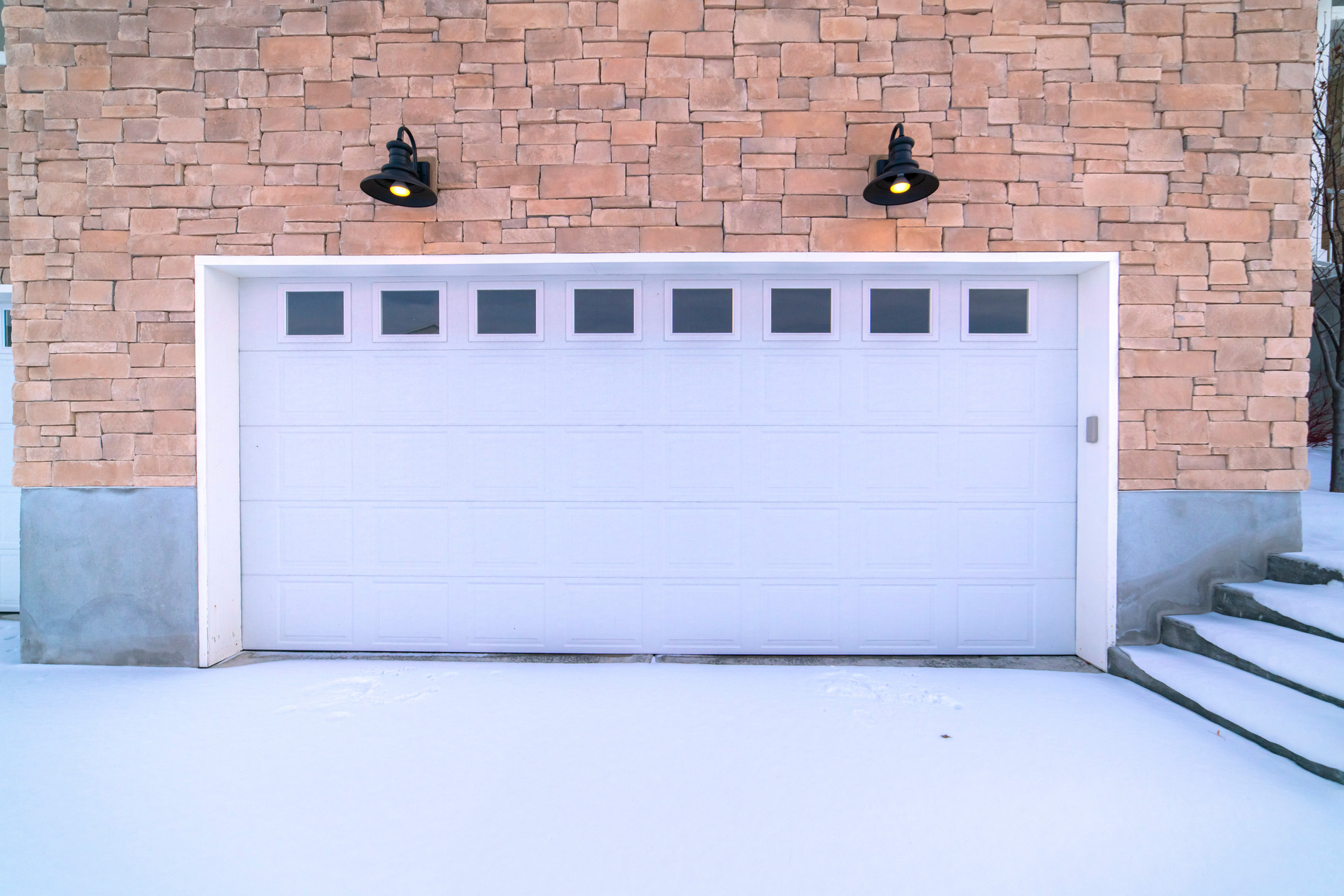 Winter Garage door damage blog image How to Inspect Your Garage Door for Damage After Winter? Blog image